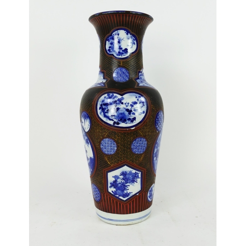 1700 - A large Japanese blue and white vase of baluster form, the circular panels enclosed with a lacquered... 