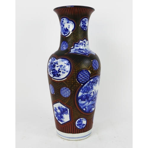 1700 - A large Japanese blue and white vase of baluster form, the circular panels enclosed with a lacquered... 