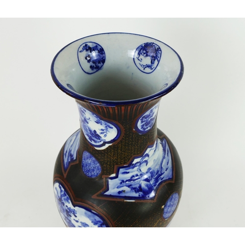 1700 - A large Japanese blue and white vase of baluster form, the circular panels enclosed with a lacquered... 