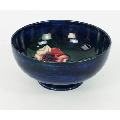 1710 - A Moorcroft pottery bowl with anemone pattern decoration, 13.5cm diameter.