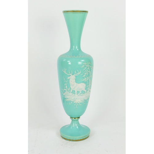 1716 - A Victorian pale green glass vase, of ovoid form with flared neck with white overlay decoration of a... 