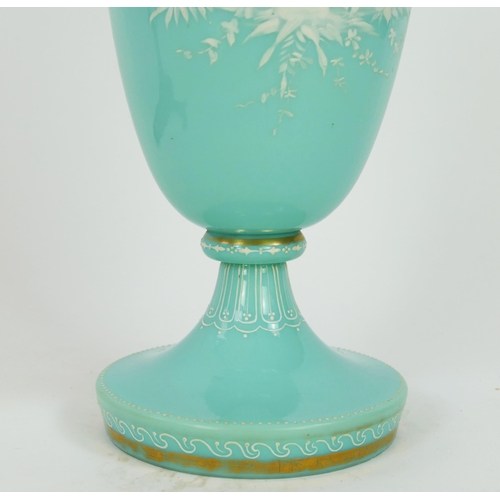 1716 - A Victorian pale green glass vase, of ovoid form with flared neck with white overlay decoration of a... 