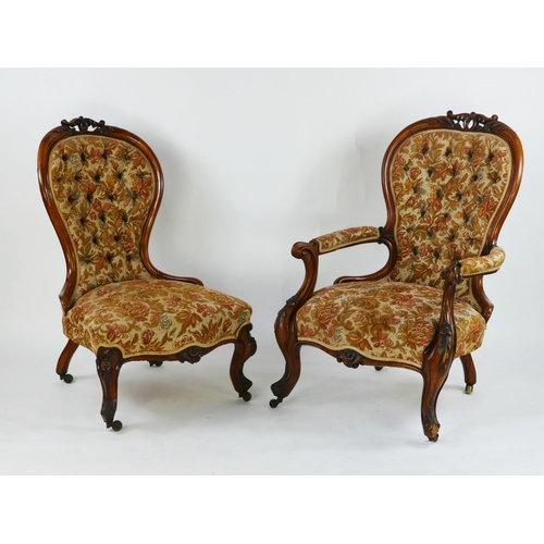 1724 - A Victorian walnut elbow chair the  button-down upholstered spoon back,  with padded armrests, stuff... 