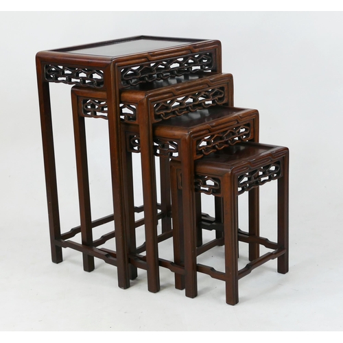 1726 - A nest of Chinese quartetto occasional tables, of rectangular outline, with pierced friezes on squar... 