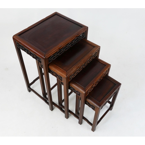 1726 - A nest of Chinese quartetto occasional tables, of rectangular outline, with pierced friezes on squar... 