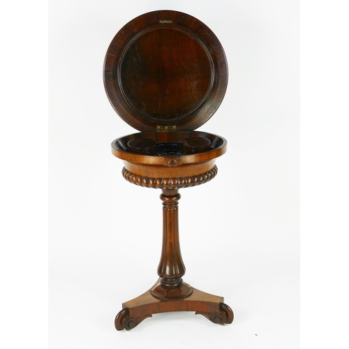 1727 - A 19th century rosewood teapoy, the circular top with hinged lid enclosing two lidded caddies and tw... 