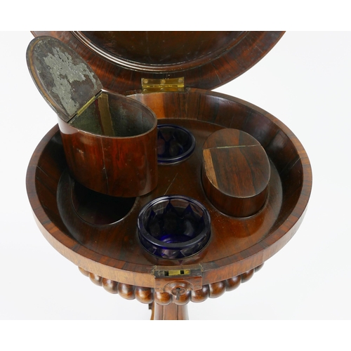 1727 - A 19th century rosewood teapoy, the circular top with hinged lid enclosing two lidded caddies and tw... 