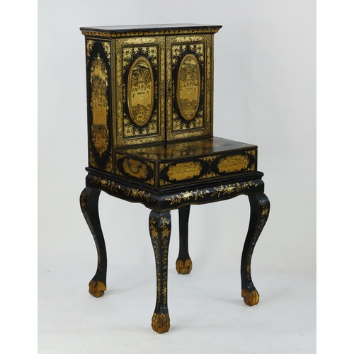 1728 - A late 19th century Chinese export lacquered writing desk, decorated all over with figures in pagoda... 