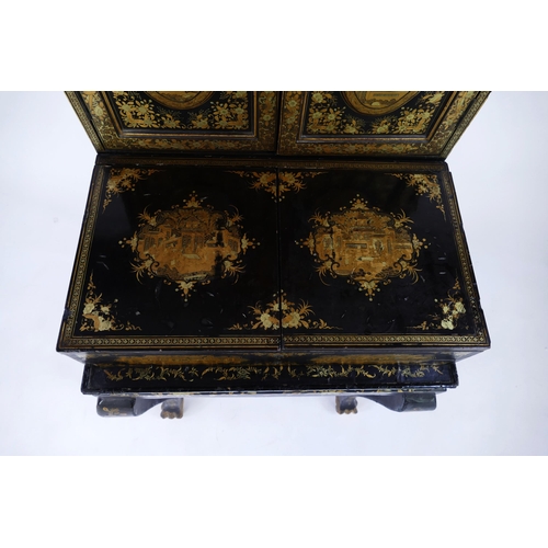 1728 - A late 19th century Chinese export lacquered writing desk, decorated all over with figures in pagoda... 