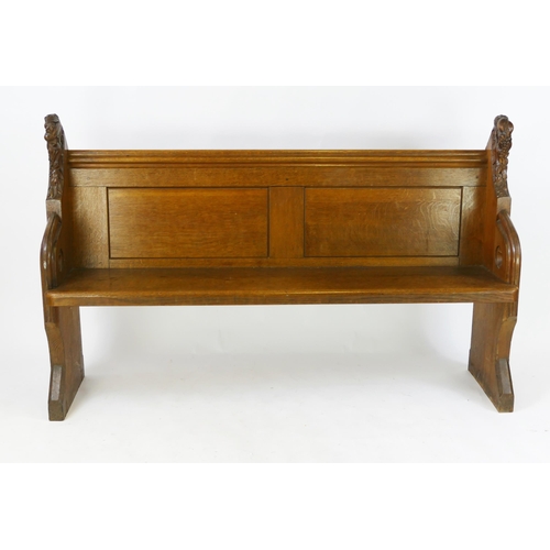 1730 - A Victorian oak church pew, the scroll ends with carved foliate decoration, and solid seat, W. 150, ... 