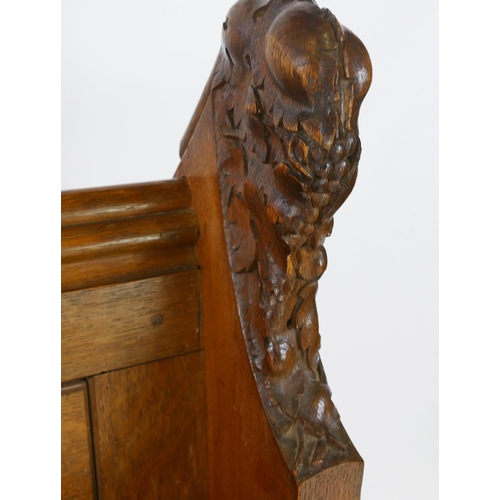 1730 - A Victorian oak church pew, the scroll ends with carved foliate decoration, and solid seat, W. 150, ... 