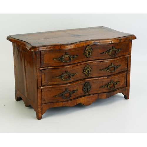 1488 - A George III period French walnut miniature chest, of serpentine outline, with crossbanded top conta... 