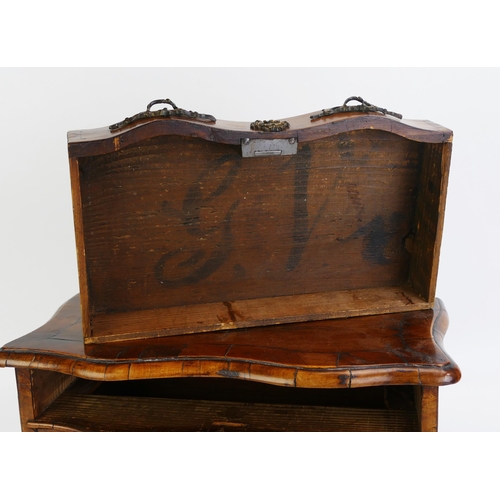 1488 - A George III period French walnut miniature chest, of serpentine outline, with crossbanded top conta... 