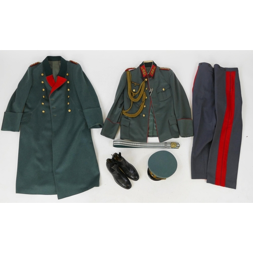 1631 - A World War II period Wehrmacht Brigadier General uniform, includes over coat, tunic, trousers, shoe... 