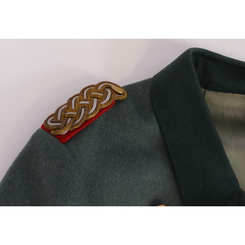 1631 - A World War II period Wehrmacht Brigadier General uniform, includes over coat, tunic, trousers, shoe... 