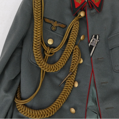 1631 - A World War II period Wehrmacht Brigadier General uniform, includes over coat, tunic, trousers, shoe... 