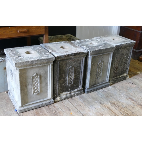 1670 - A set of four reconstituted stone plinths, with lattice decorated panels to the sides, 36cm wide, 51... 