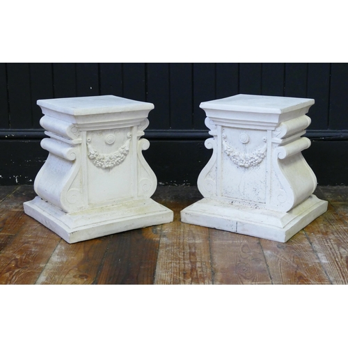 1672 - A pair of reconstituted marble plinths, with scroll decorated sides, with square top and base, 29cm ... 