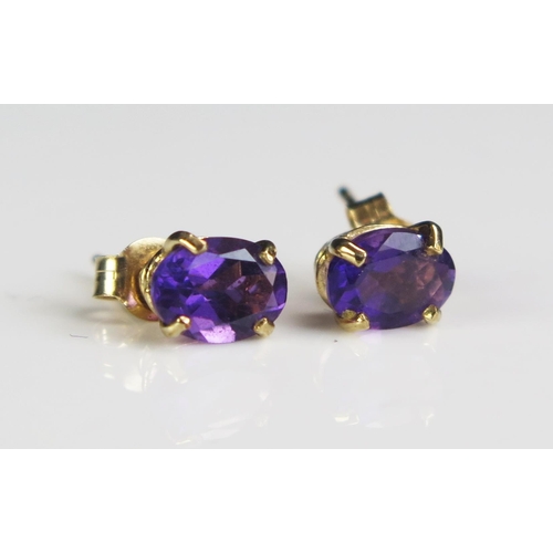 213 - A Pair of 9ct Gold and Amethyst Stud Earrings, marked 375, 0.92g