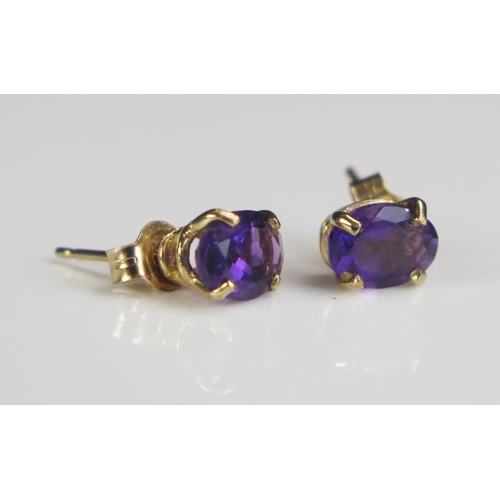 213 - A Pair of 9ct Gold and Amethyst Stud Earrings, marked 375, 0.92g