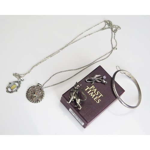 276 - A Silver and Marcasite Cat Brooch, floral brooch, two pendants on chains and a hinges bangle, 35.2g