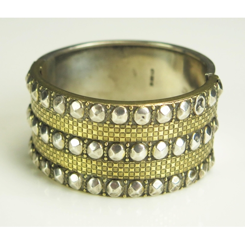 277 - A Victorian Silver and Gilt Decorative Hinged Bangle, Birmingham 1882, 48.58g