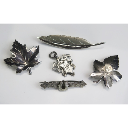 283 - A Selection of Silver including a fob, two maple leaf brooches and two others, 23.7g