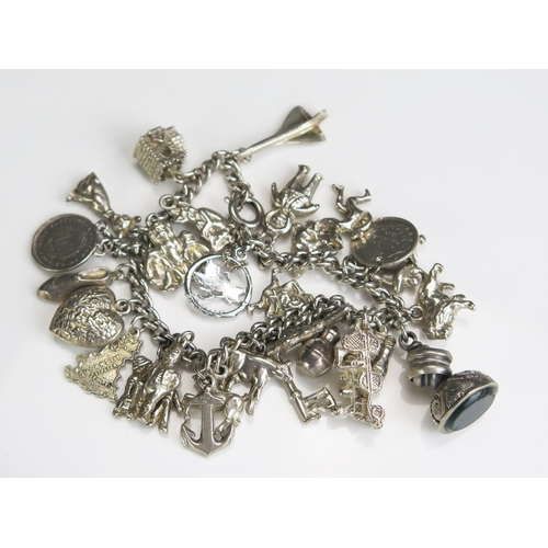 284 - A Silver Charm Bracelet, 77.6g