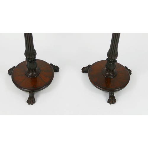 1499 - A pair of William IV rosewood pole screens, with cartouche-shaped and floral decorated screens, on t... 