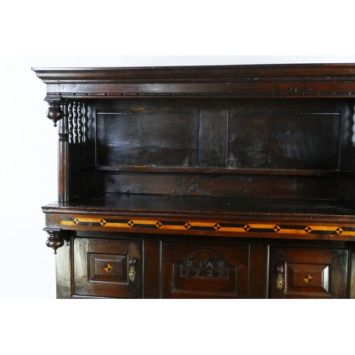 1735 - An early 18th century Welsh tridarn, the upper part with moulded cornice and panelled back with plat... 