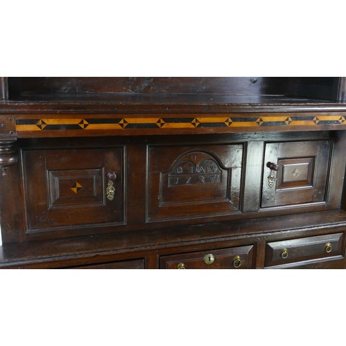 1735 - An early 18th century Welsh tridarn, the upper part with moulded cornice and panelled back with plat... 