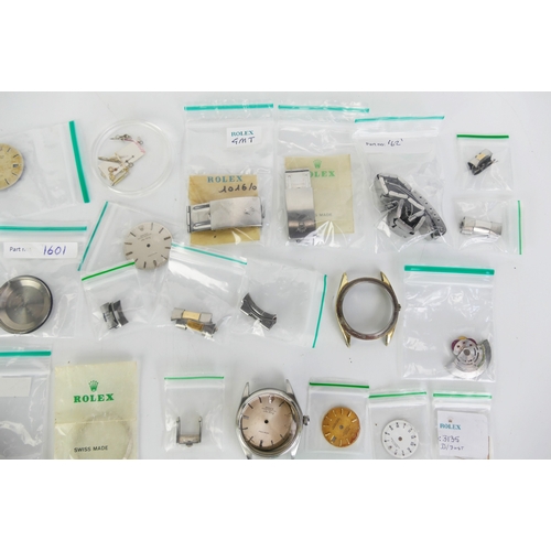 309 - A Selection of ROLEX Parts including bracelets, cases, dials, crowns, hands, etc.