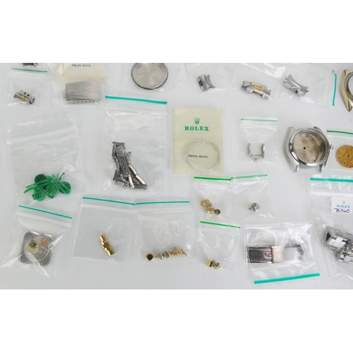 309 - A Selection of ROLEX Parts including bracelets, cases, dials, crowns, hands, etc.