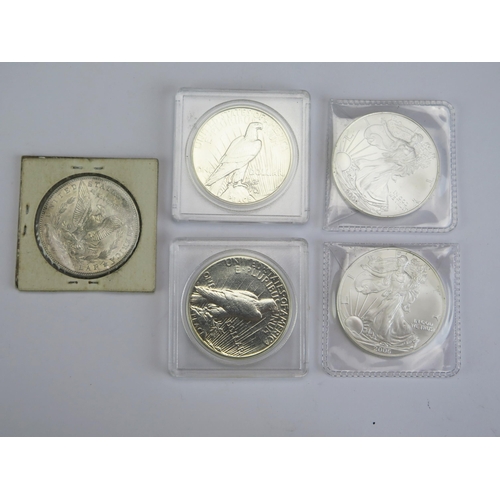 116 - A USA 1886 Morgan Dollar, 1923 Peace Dollar, 1934 Peace Dollar and two 2006 1oz fine silver dollars