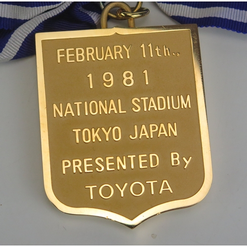 22 - A Toyota European/South American Cup 1980-81 gilt metal runners up medal of shield-shaped outline, o... 