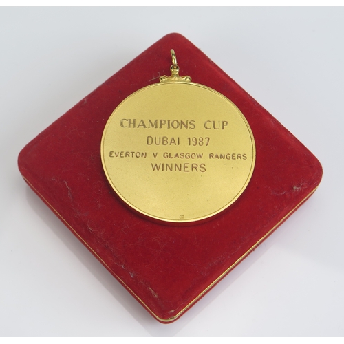 28 - A Dubai Champions Cup 1987-88 gilt metal and enamel winners medallion, Everton v. Glasgow Rangers, E... 