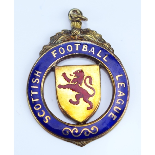 29 - A Scottish Football League The Skol Cup 987-88 9ct gold and enamel winners medal 8.62gms, contained ... 