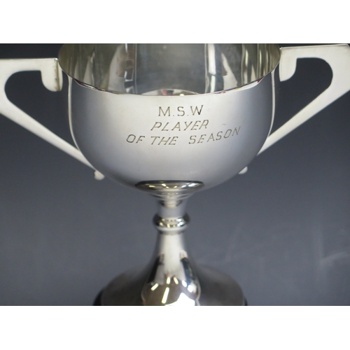 7 - An E.P.N.S. twin-handled presentation cup, inscribed “M.S.W. Player of The Season” on a plinth base ... 