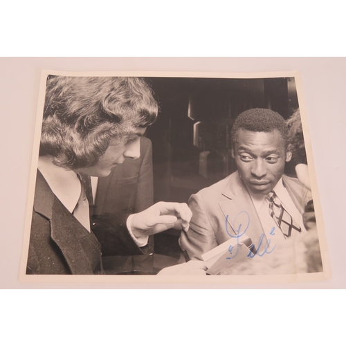 73 - A black and white photograph of Trevor Francis with Pele, signed by Pele
*SOLD WITH A LETTER OF CONF... 