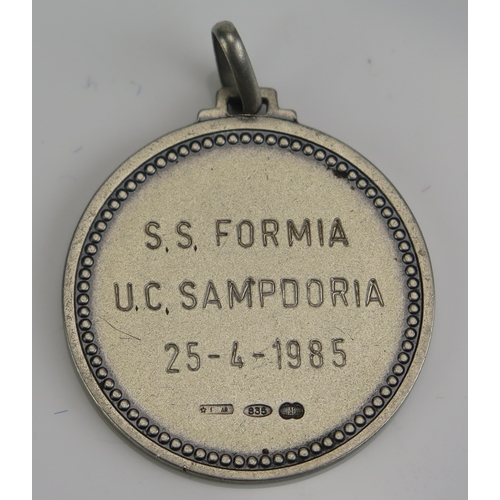 77 - A silver medallion inscribed S.S,Formia 25-4-1985, the reverse inscribed S.S.Formia under a coat of ... 