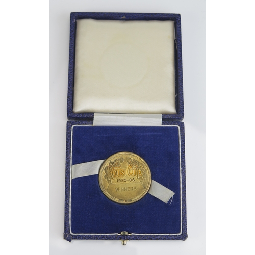 92 - The Rous Cup 1985-86 season winners medal in silver gilt, contained in presentation case, 37mm, 36gm... 