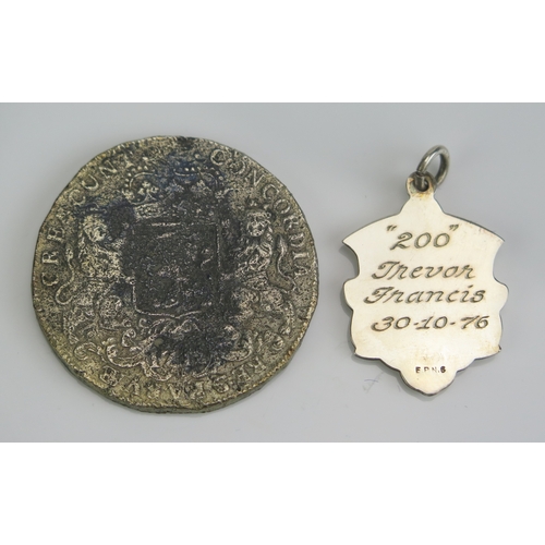 9A - A football medal inscribed to the reverse “200” Trevor Francis 30.10.76 and a replica Dutch ducaton.... 