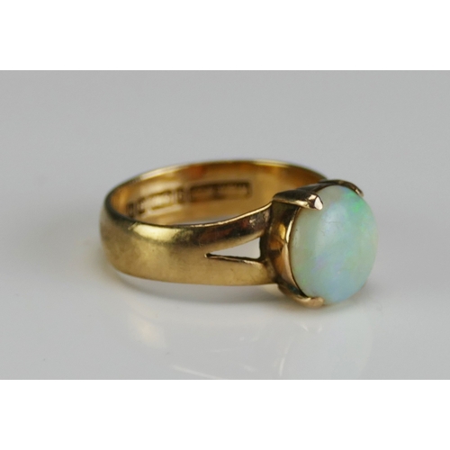 12 - A 9ct Gold and Opal Ring, 9.1mm stone, size J, hallmarked, 3g