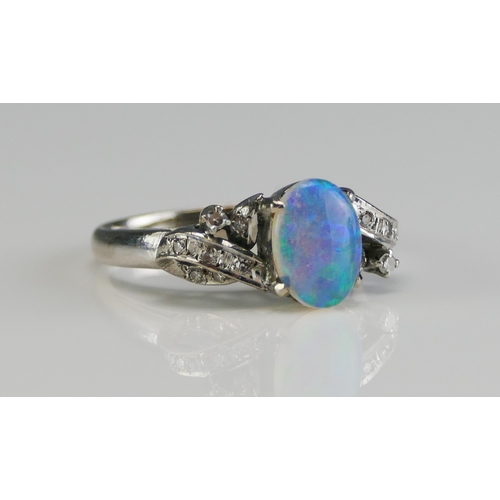 149 - A 14K White Gold, Opal and Diamond Ring, 8.77x6.3mm principal stone, size L, stamped 14K, 3.63g