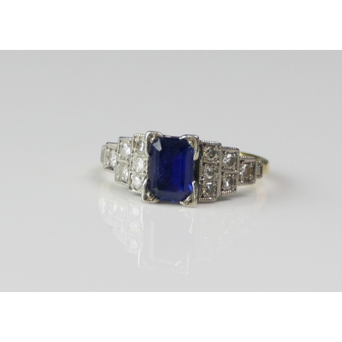 150 - An Art Deco Style 18ct Gold, Diamond and Gem Set Ring, the central 6.86x4.83mm central stone shoulde... 