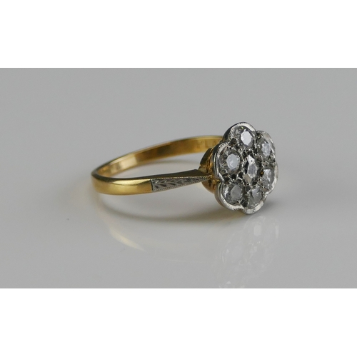 152 - An 18ct Gold, Platinum and Diamond Flower Head Ring, 10.1mm head, stamped 18CT PLAT, 2.78g