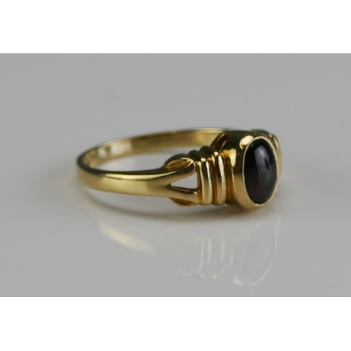 153 - A 9ct Gold and Cabochon Garnet Ring, size L.5, hallmarked, 2.55g