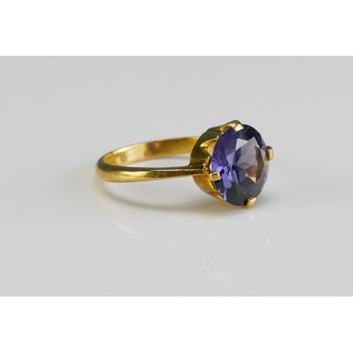 158 - An Alexandrite? Colour Change Gem Set Ring in a high carat precious yellow metal setting, 10.8mm sto... 