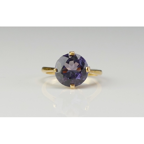 158 - An Alexandrite? Colour Change Gem Set Ring in a high carat precious yellow metal setting, 10.8mm sto... 