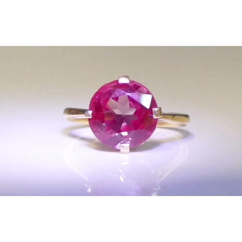 158 - An Alexandrite? Colour Change Gem Set Ring in a high carat precious yellow metal setting, 10.8mm sto... 